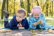 Small Children Relaxing In A Park In Autumn Royalty Free Stock Image Small Children Relaxing In A Park In Autumn Royalty Free Stock Image