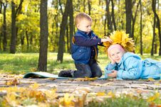 Little Boy Making An Autumn Hat For His Sister Royalty Free Stock Image Little Boy Making An Autumn Hat For His Sister Royalty Free Stock Image