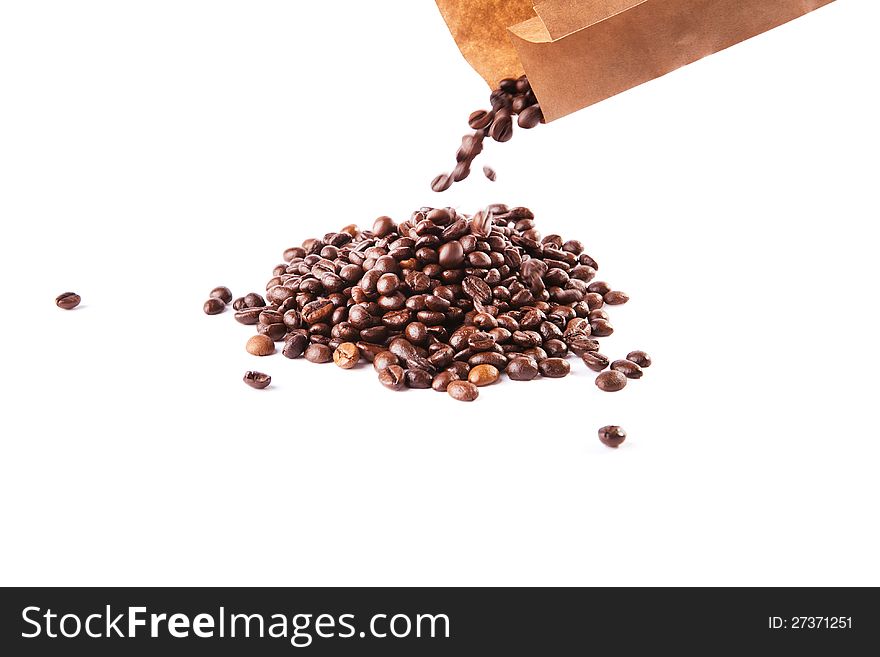 Paper bag with grain coffee on white background