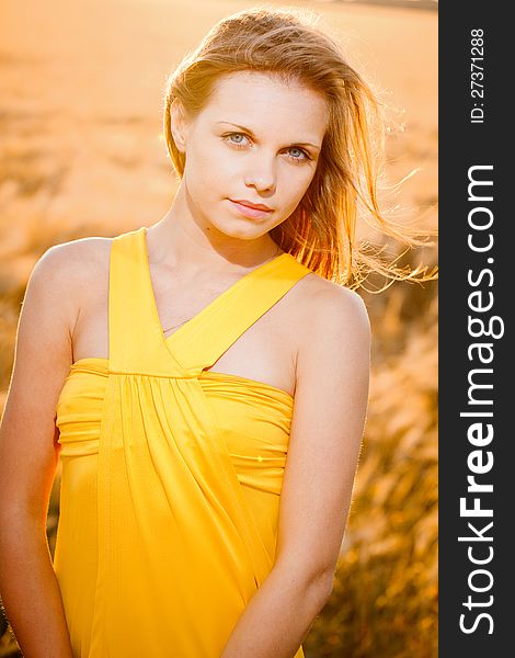 Portrait of a fresh and beautiful young fashion model posing outdoor in sunny weather. Portrait of a fresh and beautiful young fashion model posing outdoor in sunny weather