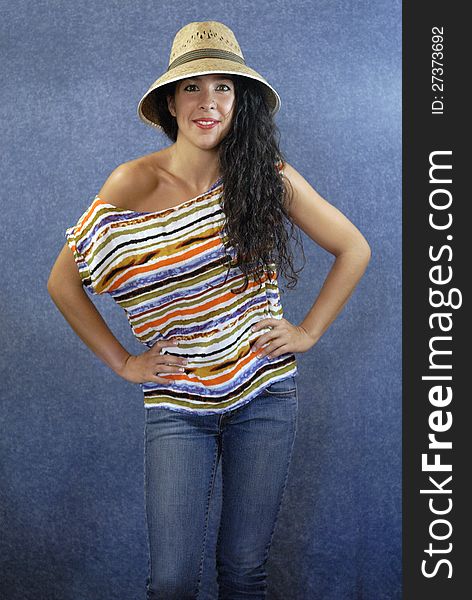 Beautiful latin young woman with shirt colors and hat. Beautiful latin young woman with shirt colors and hat