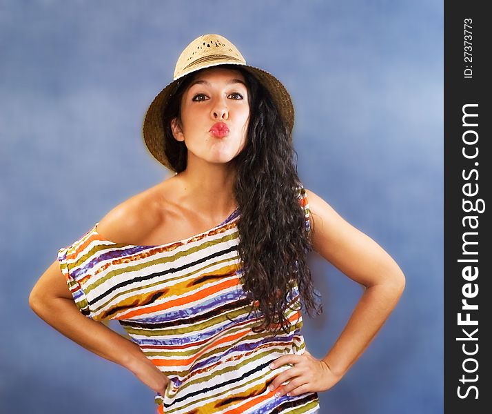 Beautiful latin young woman with shirt colors and hat. Beautiful latin young woman with shirt colors and hat