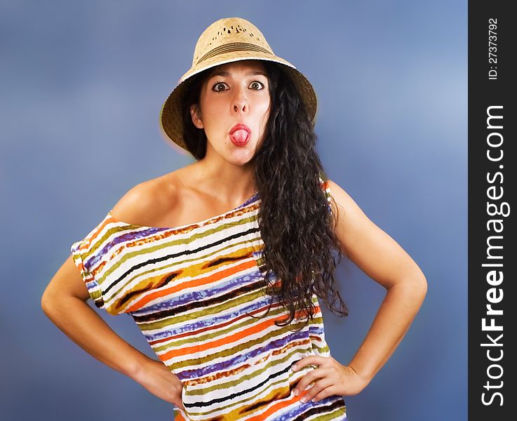 Beautiful latin young woman with shirt colors and hat. Beautiful latin young woman with shirt colors and hat