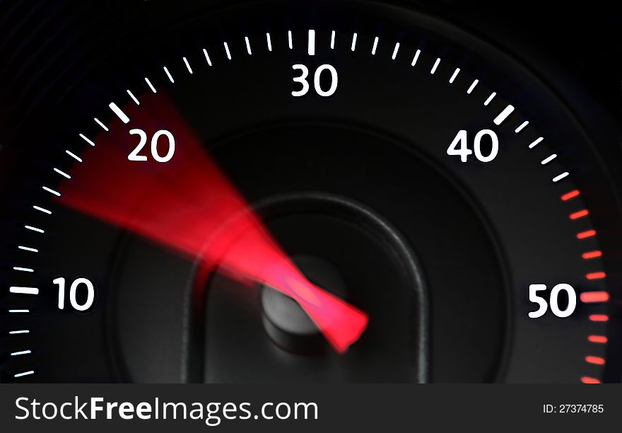 Rev-counter gauge (tachometer) of a diesel engine at night, indicating a range of fuel-saving low rotation speeds with a red needle. Rev-counter gauge (tachometer) of a diesel engine at night, indicating a range of fuel-saving low rotation speeds with a red needle