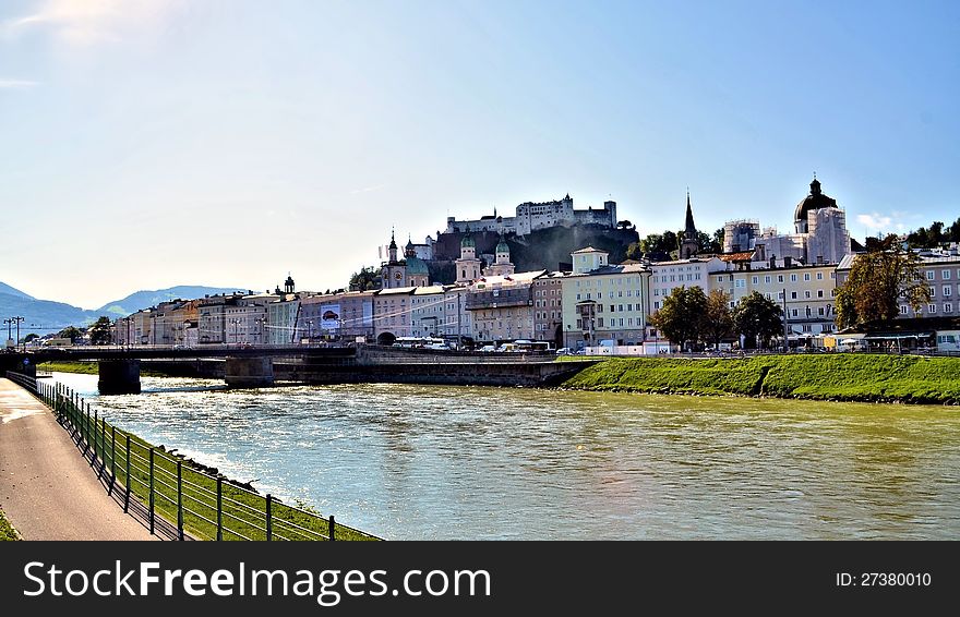 River at Salzburg Austria with buildings and bridge on a sunny day