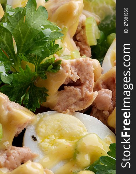 Background of Delicious Salad with Cod Liver, Quail Eggs and Parsley closeup. Background of Delicious Salad with Cod Liver, Quail Eggs and Parsley closeup