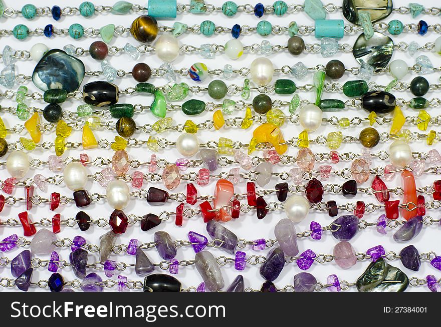 Close-up Colored stone necklace  on background