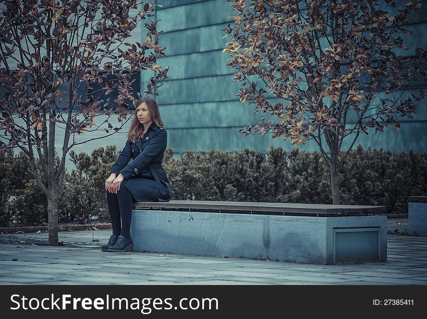 Girl sit strait on the bench. Girl sit strait on the bench