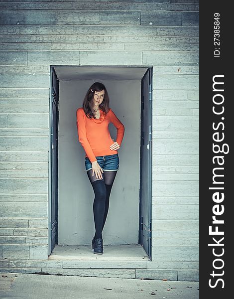 Girl posing in the concrete alcove. Girl posing in the concrete alcove