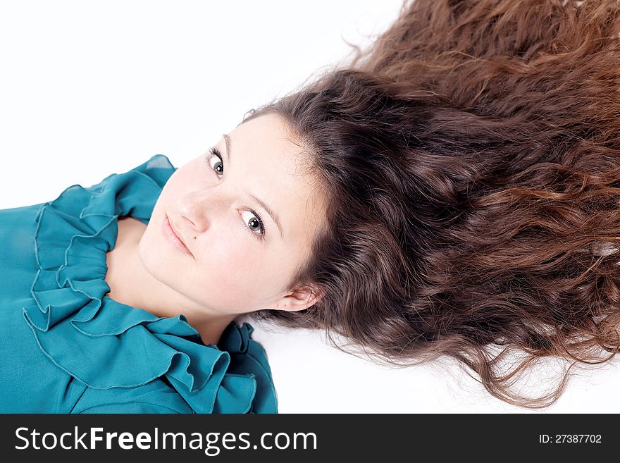 Pretty girl with long curly hair isolated