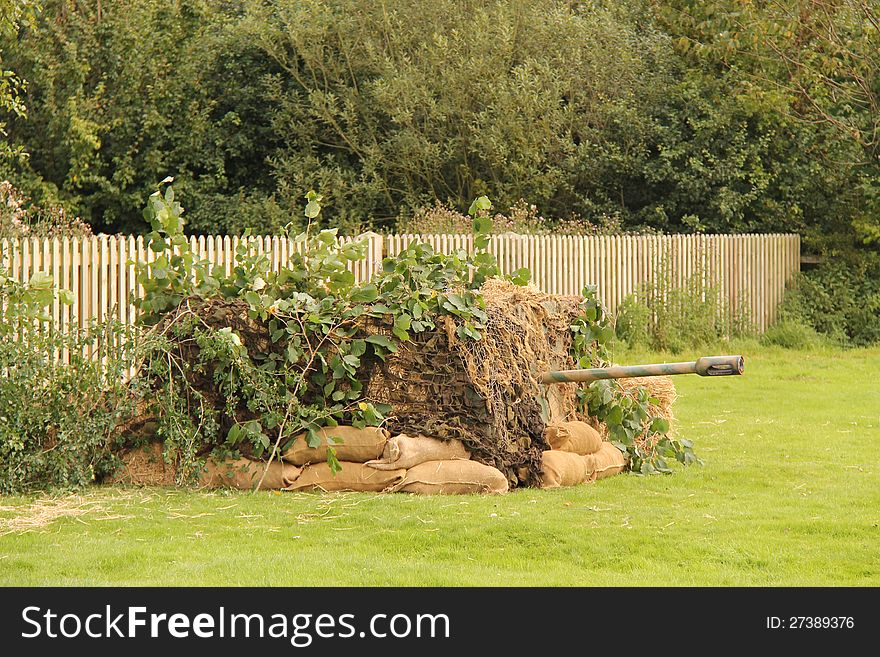 A Mock-up of a Camouflaged Gun Enplacement. A Mock-up of a Camouflaged Gun Enplacement.