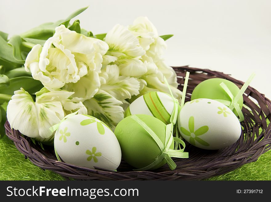 Easter basket with eggs and tulips. Easter basket with eggs and tulips