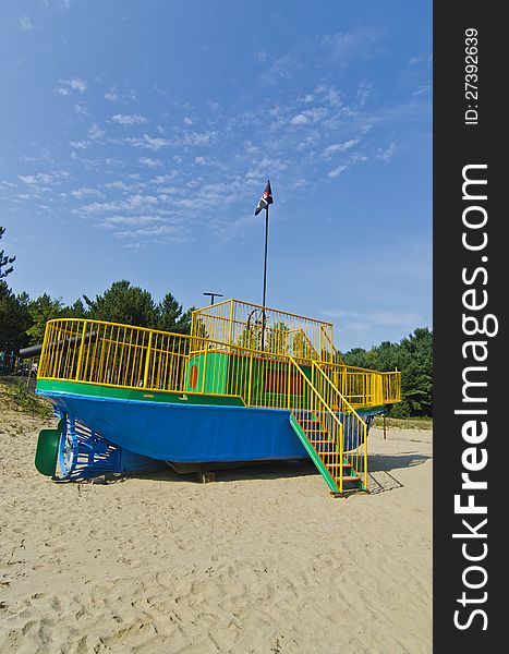 A tugboat converted into a playground pirate ship with pirate flag for children. A tugboat converted into a playground pirate ship with pirate flag for children.