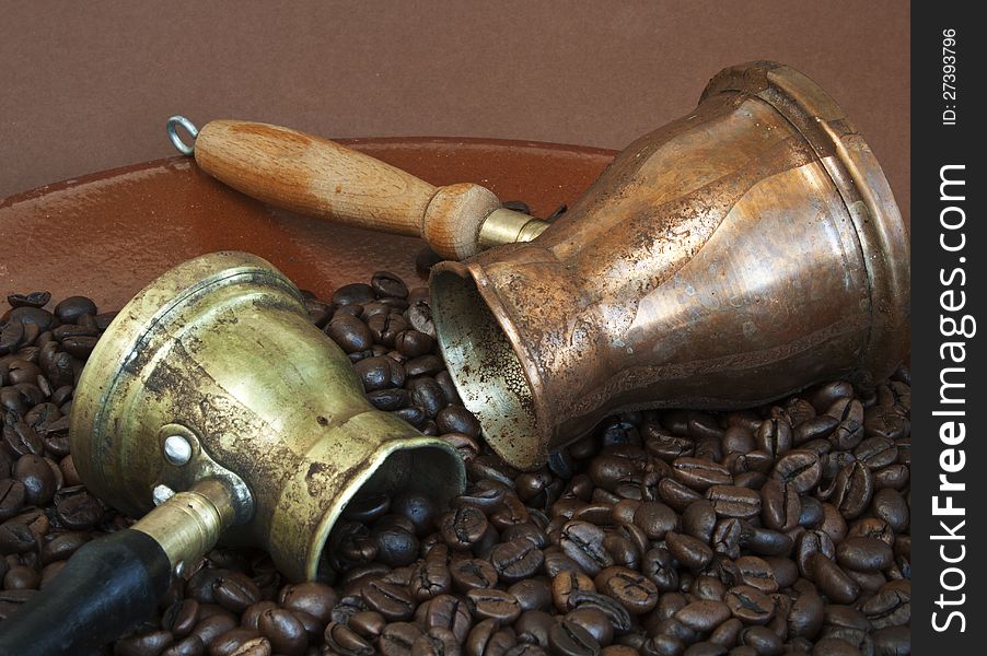 Arab coffee pots and roasted coffee beans. Arab coffee pots and roasted coffee beans