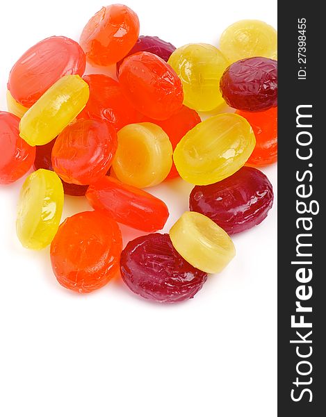 Heap of Multi Coloured Fruit Drops on white background