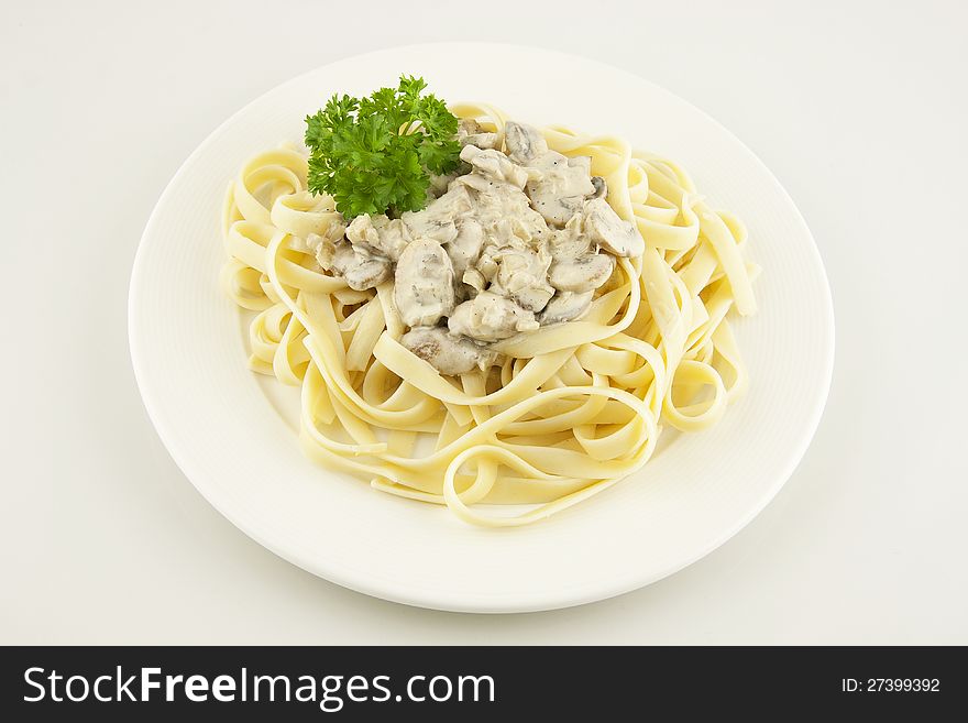 Italian pasta linguini with mushrooms and cream sauce. Italian pasta linguini with mushrooms and cream sauce