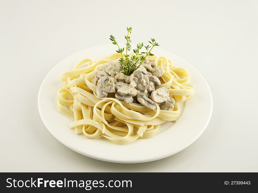 Italian pasta linguini with mushrooms and cream sauce. Italian pasta linguini with mushrooms and cream sauce