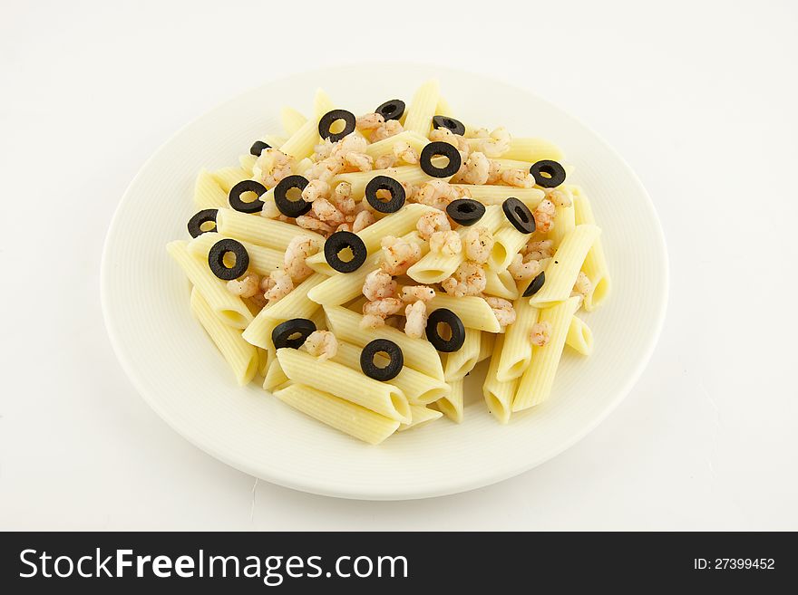 Italian pasta penne with shrimps and olives. Italian pasta penne with shrimps and olives