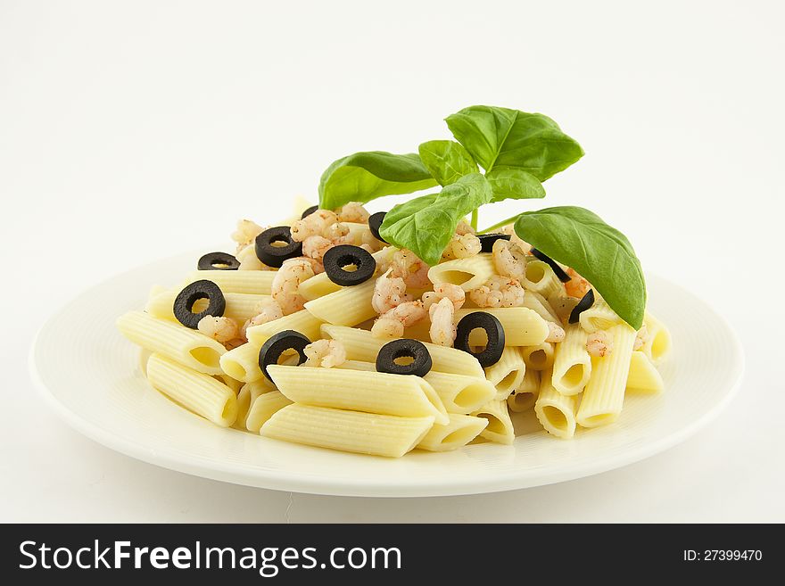 Italian pasta penne with shrimps and olives. Italian pasta penne with shrimps and olives