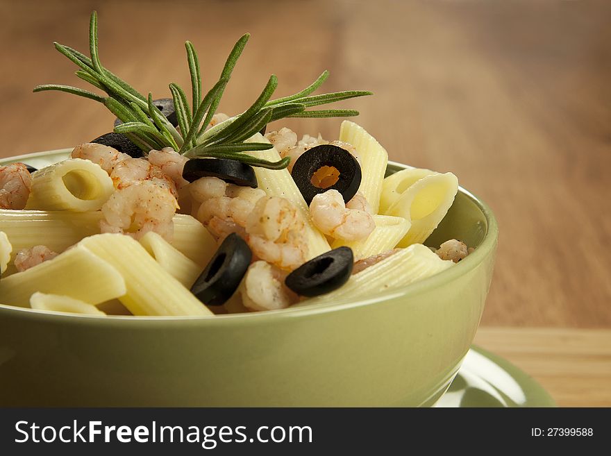 Italian pasta penne with shrimps and olives. Italian pasta penne with shrimps and olives