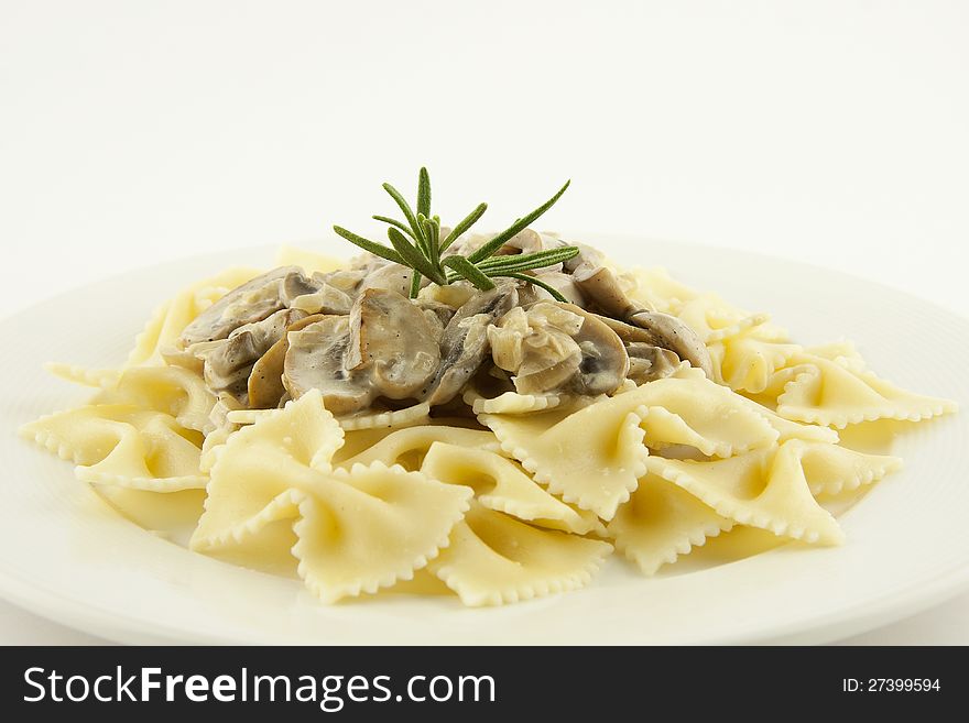 Italian pasta farfalle with mushrooms and cream sauce. Italian pasta farfalle with mushrooms and cream sauce