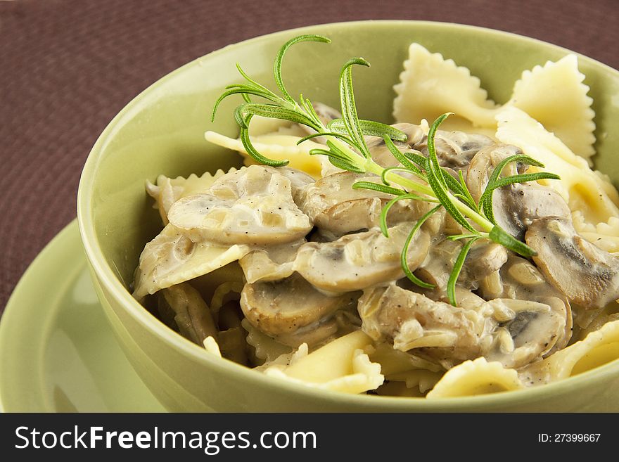 Italian  pasta farfalle with mushrooms and cream sauce. Italian  pasta farfalle with mushrooms and cream sauce