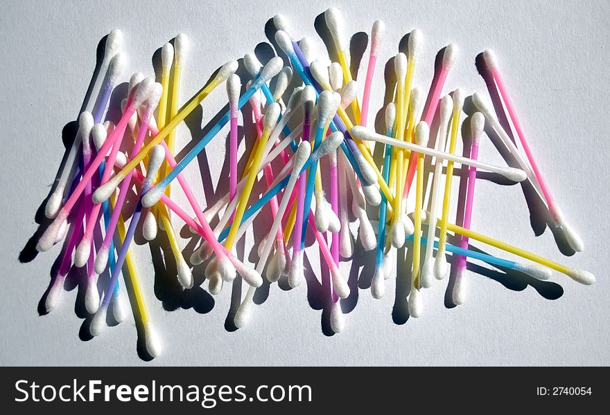 Colored cotton tip buds randomly arranged. Colored cotton tip buds randomly arranged