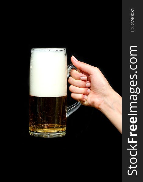 Beer in woman hand with black background