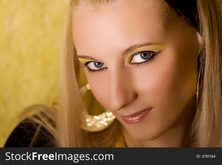 Portrait of young beautiful  blond girl on yellow background. Portrait of young beautiful  blond girl on yellow background