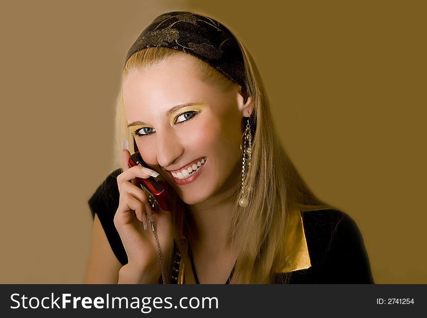 Young beautiful  blond girl with mobile phone