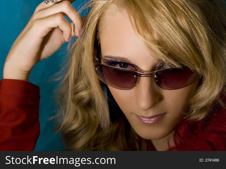 Portrait of young beautiful  blond girl in sun glasses