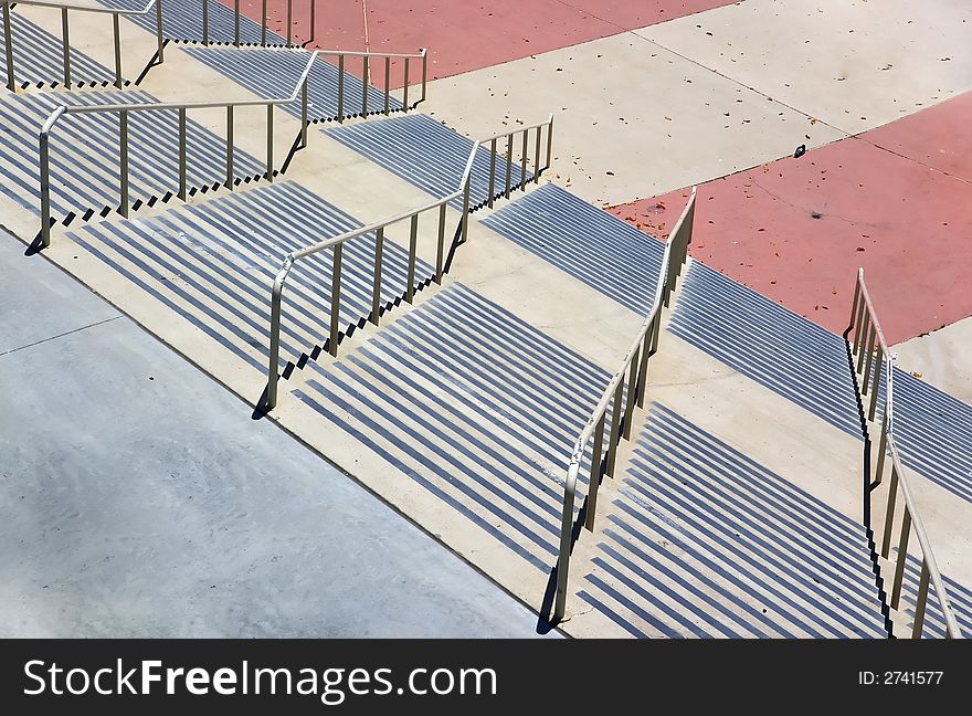 Multiple rows of descending concrete stairs. Multiple rows of descending concrete stairs