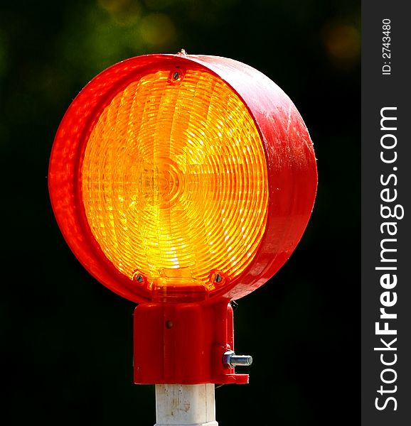 Yellow warning lamp at a road construction