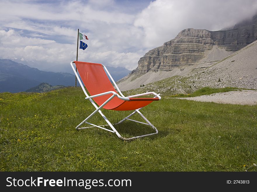 Chaise longue and a beautiful alpine scenic