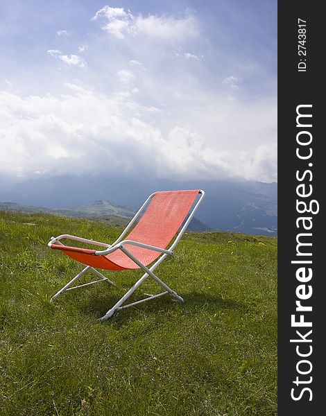 Chaise longue and a beautiful alpine scenic