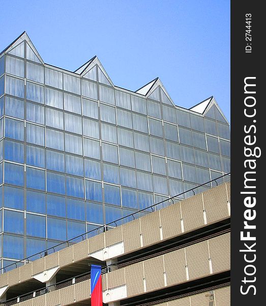 Modern glass building with blue sky. Modern glass building with blue sky
