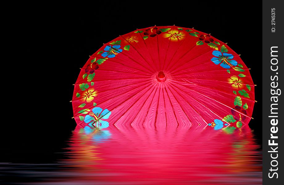 Colorful red unbrella, opened in puddle of water, with reflection. Colorful red unbrella, opened in puddle of water, with reflection.