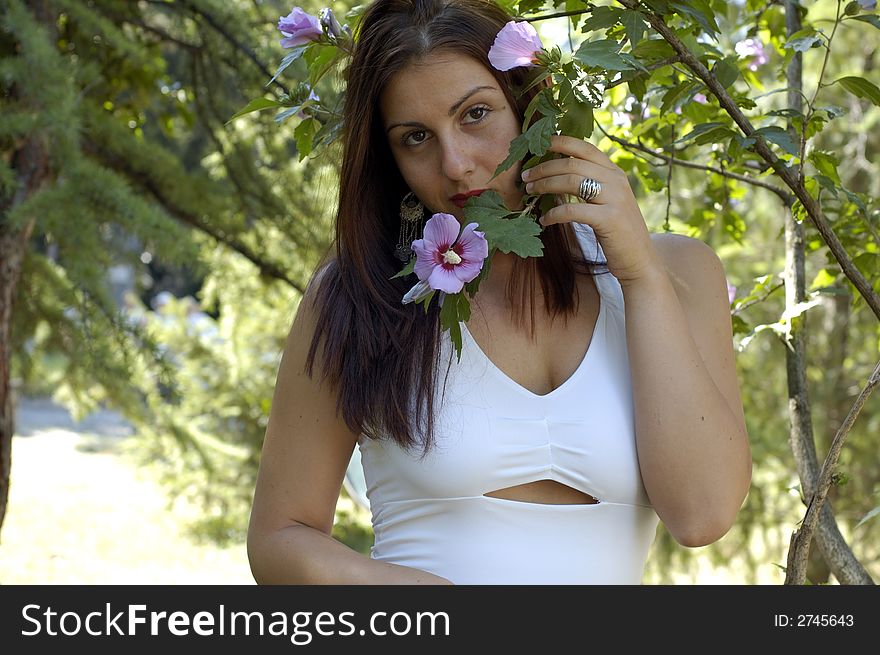 Pretty women relaxing on a fresh grass in a park. Pretty women relaxing on a fresh grass in a park