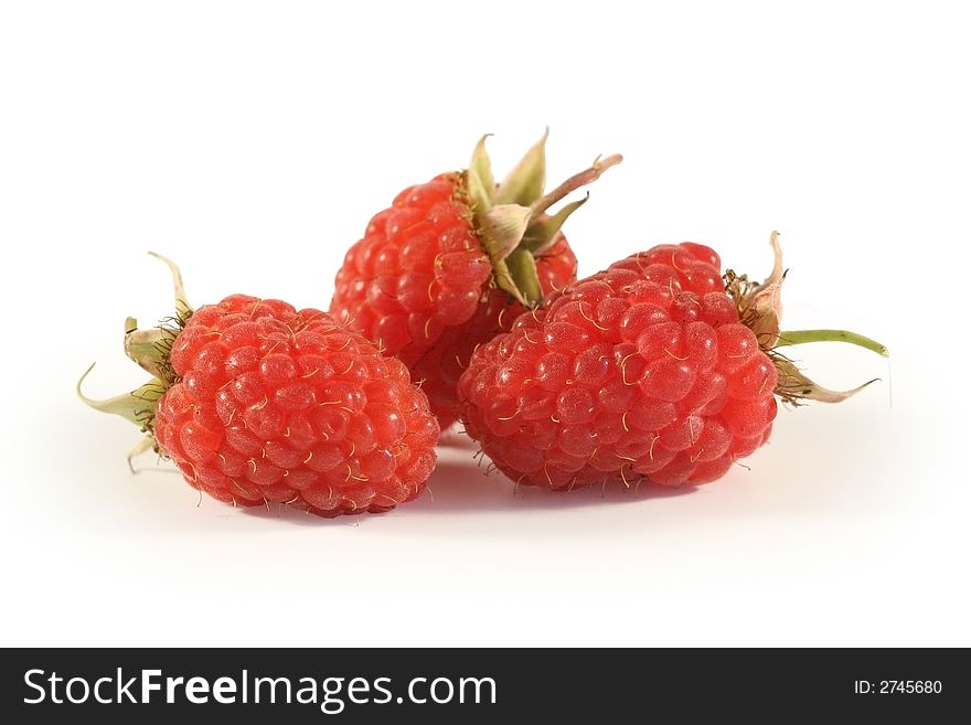 Berries of a raspberry it is photographed on a white background close up. Berries of a raspberry it is photographed on a white background close up.
