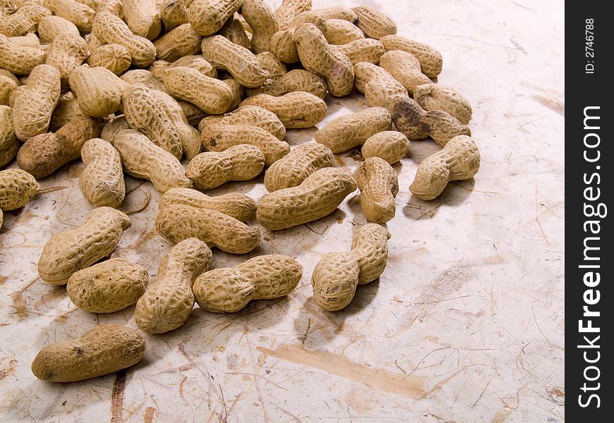 Roasted peanuts on decorative paper
