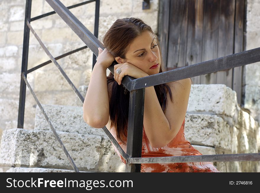 Young woman looking up outdoors