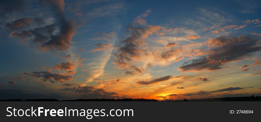 The panoramic view. The sky at sunset near Borovsk, small historic town of Kaluga region, Russian Federation. The panoramic view. The sky at sunset near Borovsk, small historic town of Kaluga region, Russian Federation