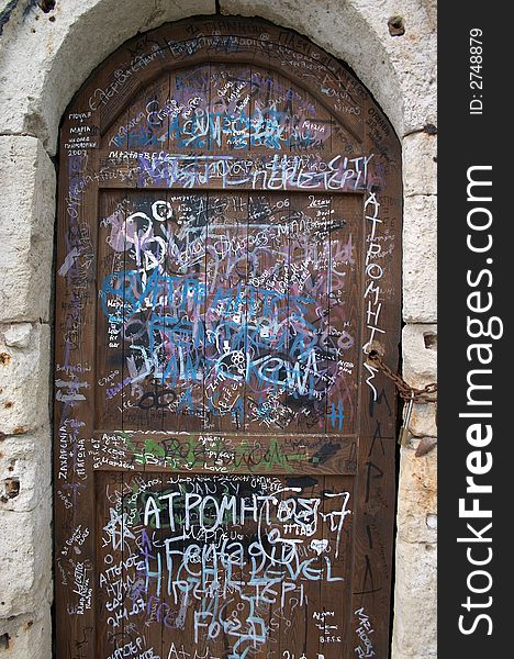 Graffiti on the old wooden door. Graffiti on the old wooden door