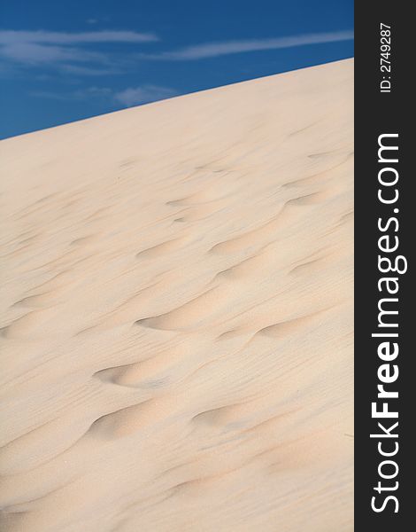 Sand dunes with a nice blue sky and white clouds!. Sand dunes with a nice blue sky and white clouds!