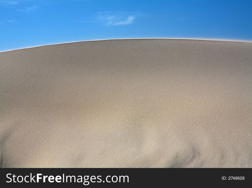 Sand dunes with a nice blue sky and white clouds!. Sand dunes with a nice blue sky and white clouds!