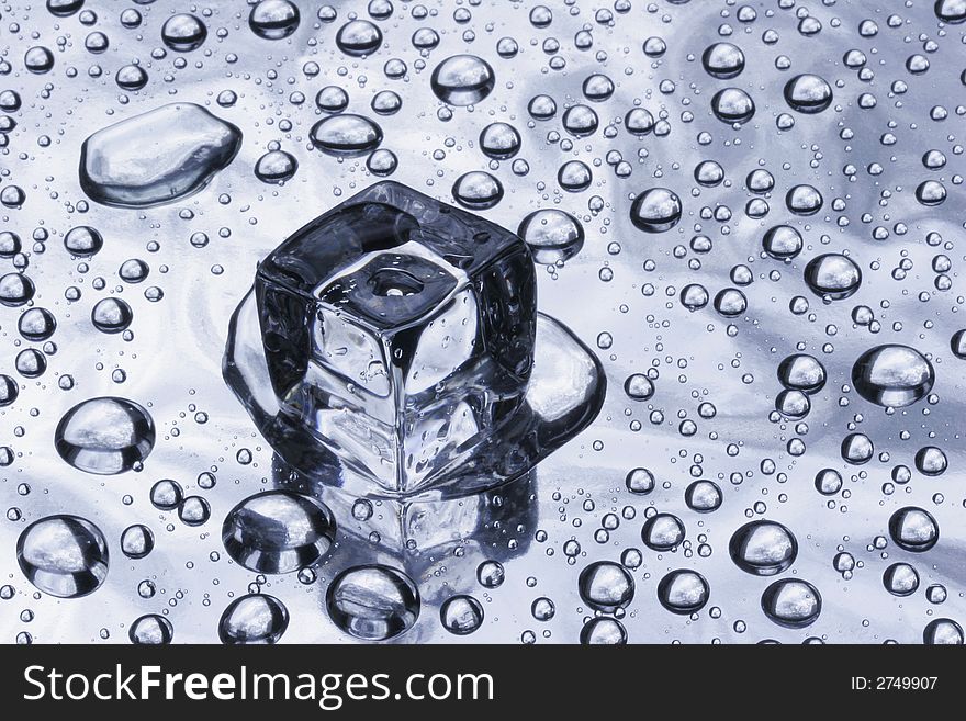 Piece of an ice and water drops