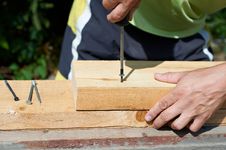 Man Working With A Hammer Stock Images