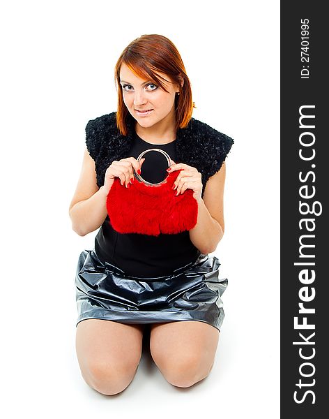 Beautiful girl with a bright red bag sits. Beautiful girl with a bright red bag sits