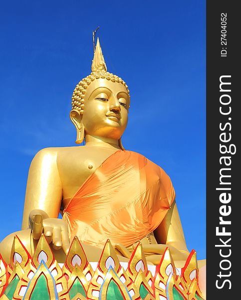 View of a big buddha statue with a blue sky, Pathumthani, Thailand