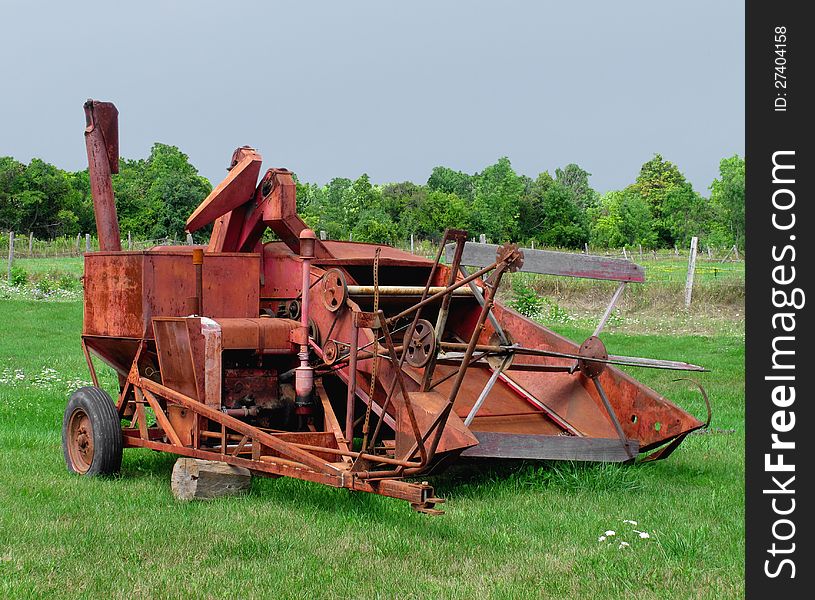 Old rusty tractor pulled combine